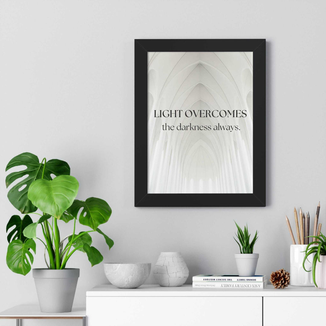 Framed Light Wins Always poster with inspiring message on white architectural background displayed above modern shelf with plants and decor