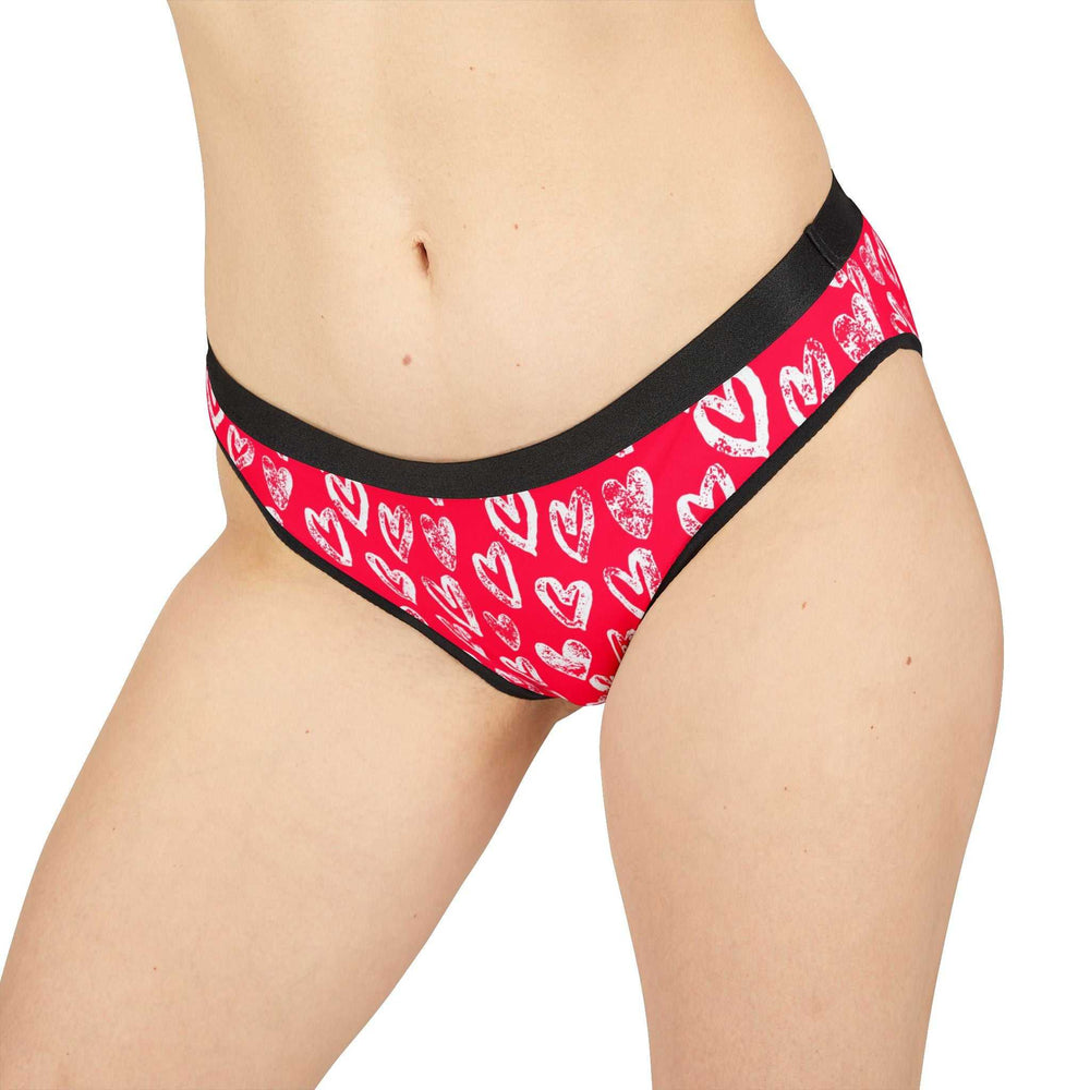 Women's pink briefs with white heart prints and black elastic waistband, breathable and stretchy fabric for comfortable fit