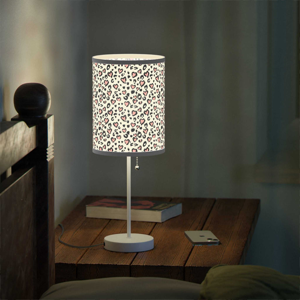 Leopard Hearts Lamp with steel base and high-resolution printed shade featuring leopard print hearts design on wooden bedside table