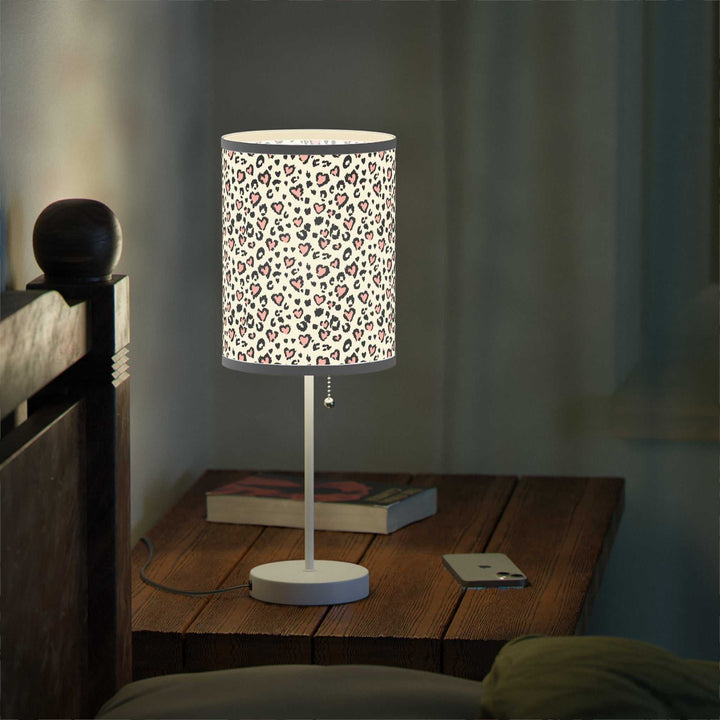 Leopard Hearts Lamp with steel base and high-resolution printed shade featuring leopard print hearts design on wooden bedside table