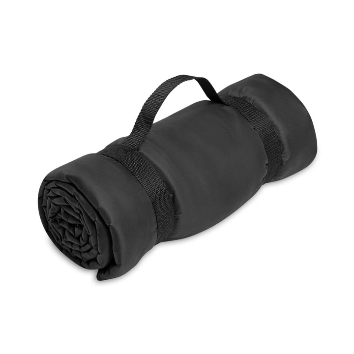 Rolled black cross pattern picnic blanket with carrying strap and water-resistant backing