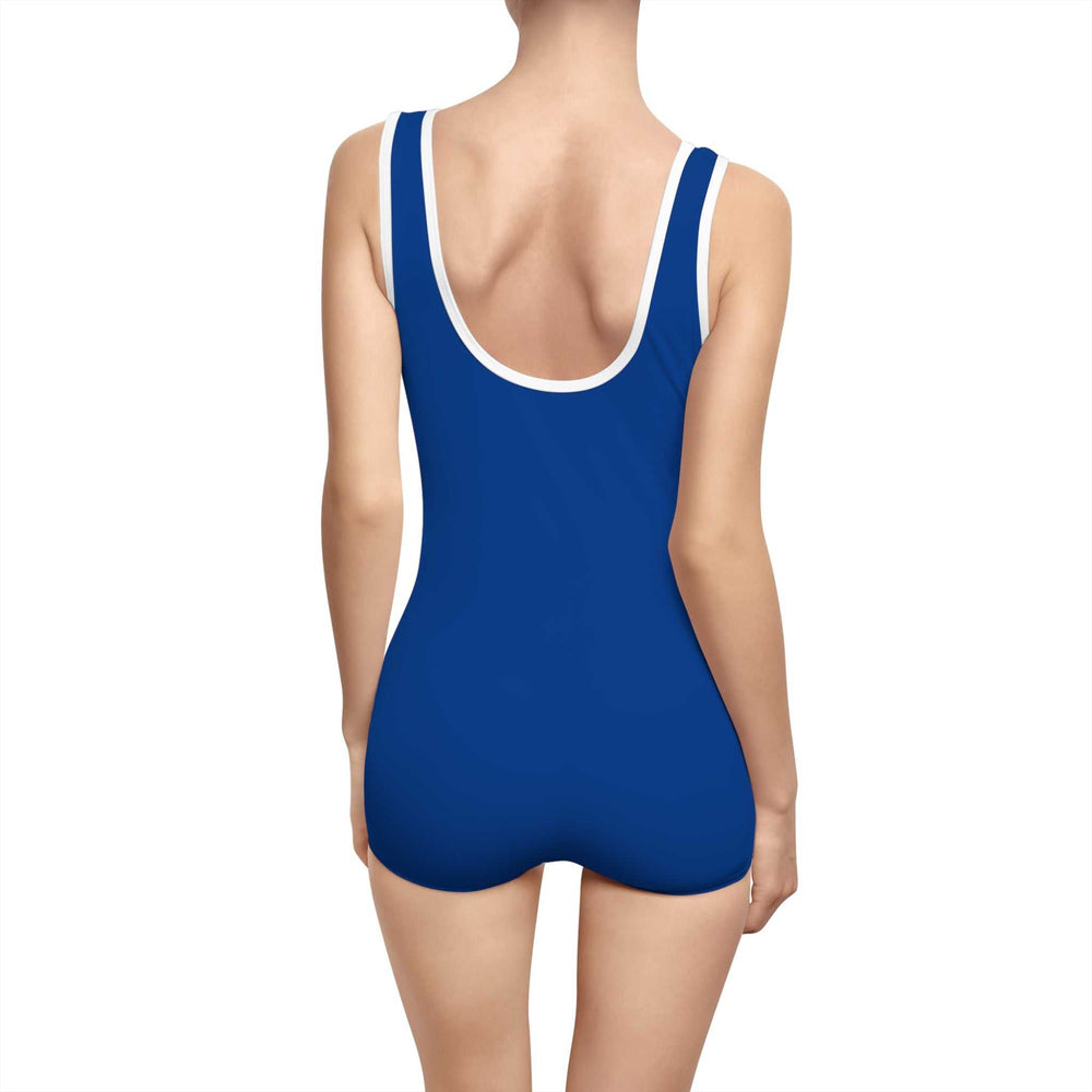 Back view of a woman wearing a blue Keep The Faith Swimsuit with a deep U-shaped neck and white trim, vintage one-piece style
