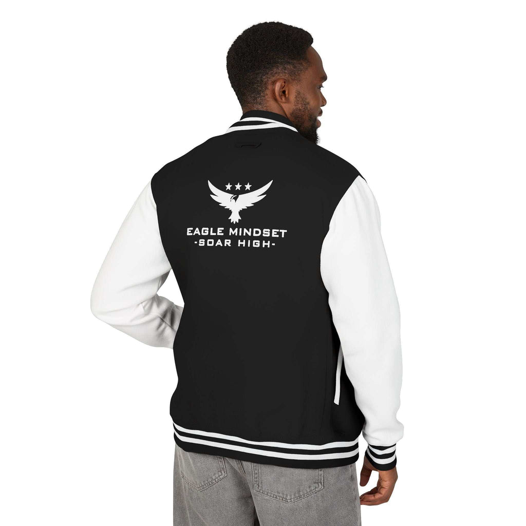 Man wearing Eagle Mindset black and white varsity jacket with eagle graphic on back