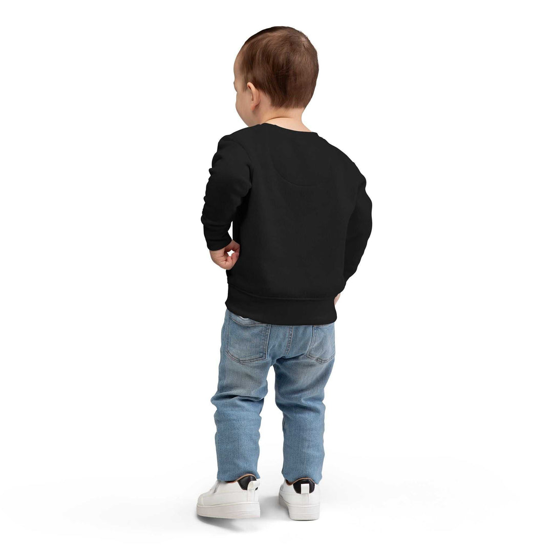 Toddler wearing black sweatshirt with ribbed cuffs and waistband from back