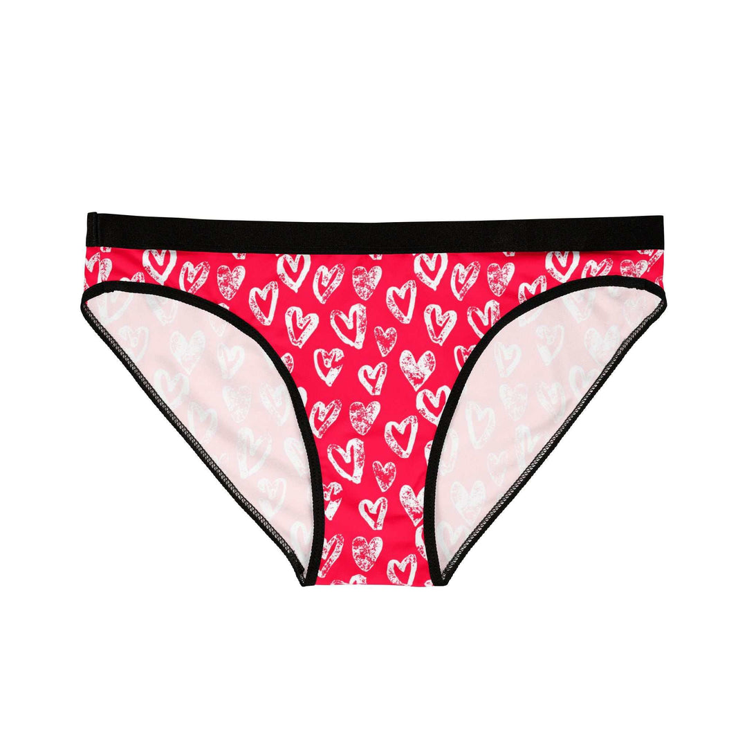 Pink briefs with white heart prints, black elastic waistband and trim, breathable antimicrobial fabric, and four-way stretch for comfort and support.