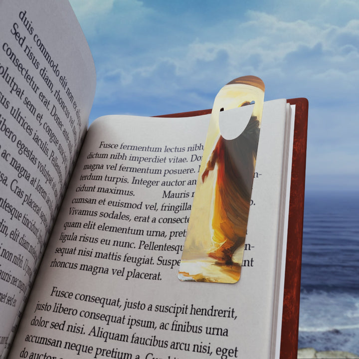 Jesus Christ aluminum bookmark holding a page in an open book against ocean background