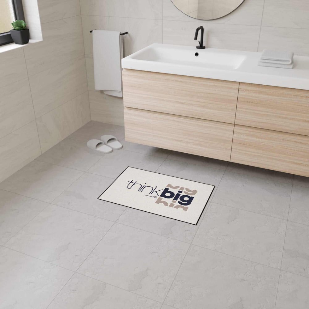 Think Big Floor Mat with custom design, non-slip backing, 100% polyester, black trim in modern bathroom setting