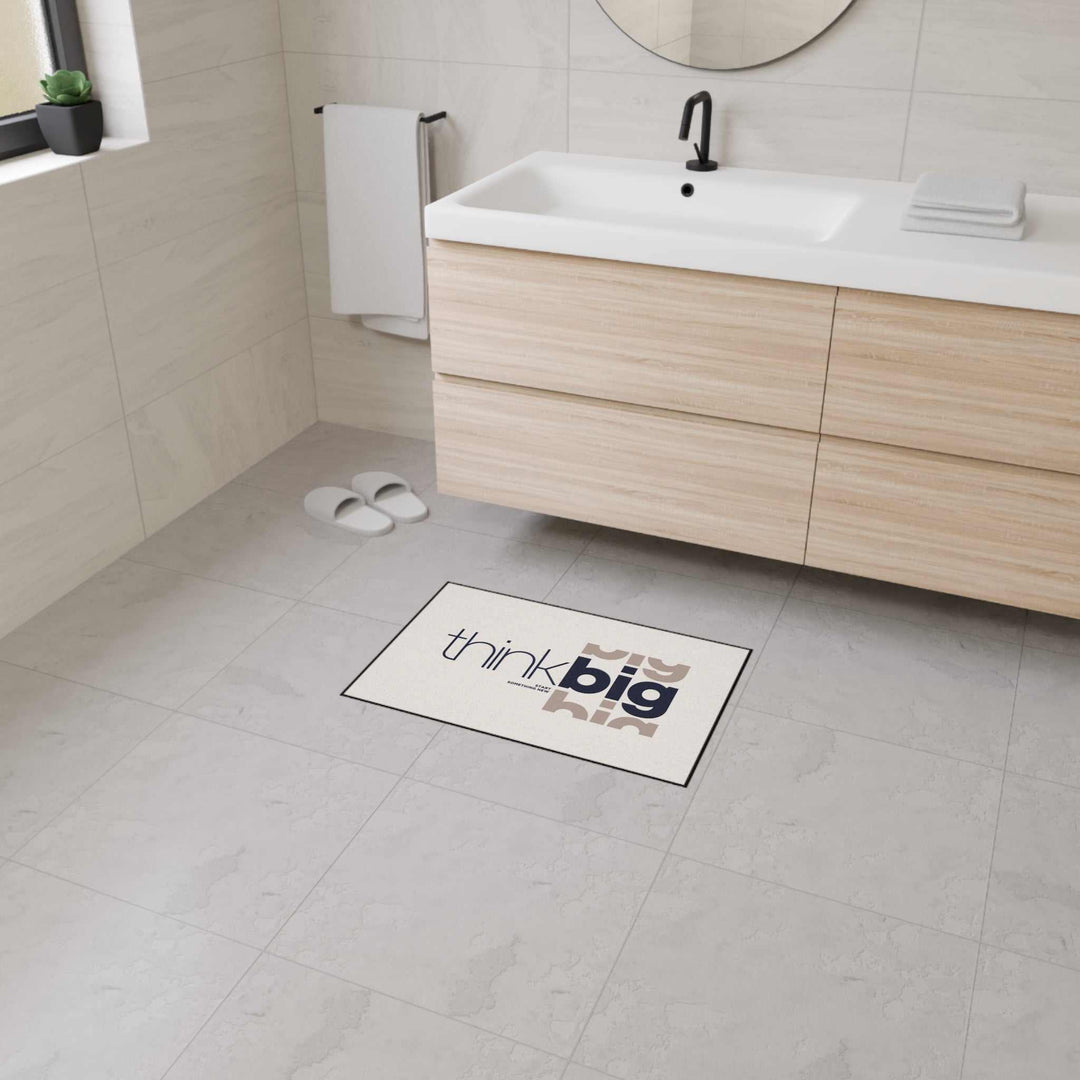 Think Big Floor Mat with custom design, non-slip backing, 100% polyester, black trim in modern bathroom setting