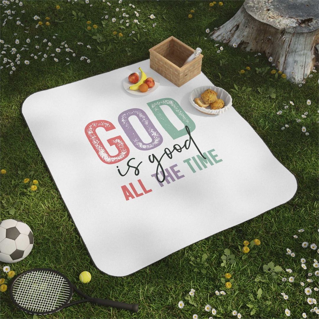 Christian picnic blanket with positive quote "God is good all the time" on soft white fleece, perfect for outdoor use with water-resistant backing and carrying strap