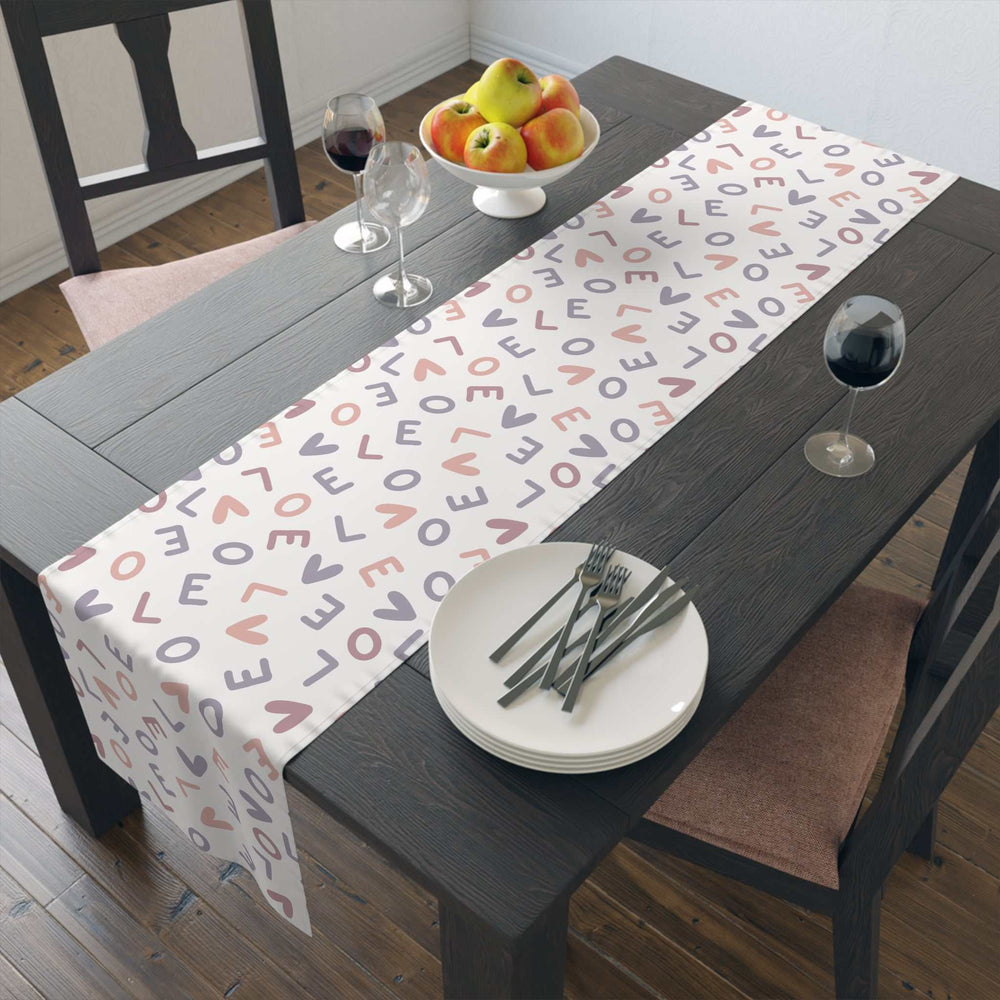 Love Pattern Table Runner on dark wood dining table with plates, wine glasses, and fruit bowl