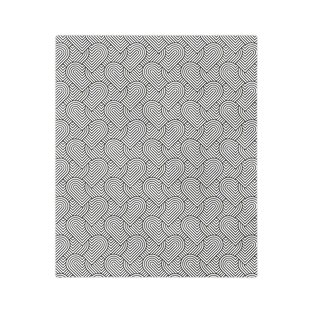 Colorful hearts blanket with black and white geometric heart design on soft fleece fabric