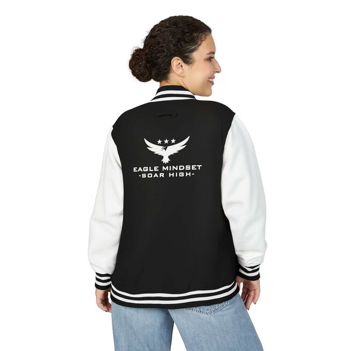 Black and white Eagle Mindset jacket with white sleeves and logo on the back, worn by a woman