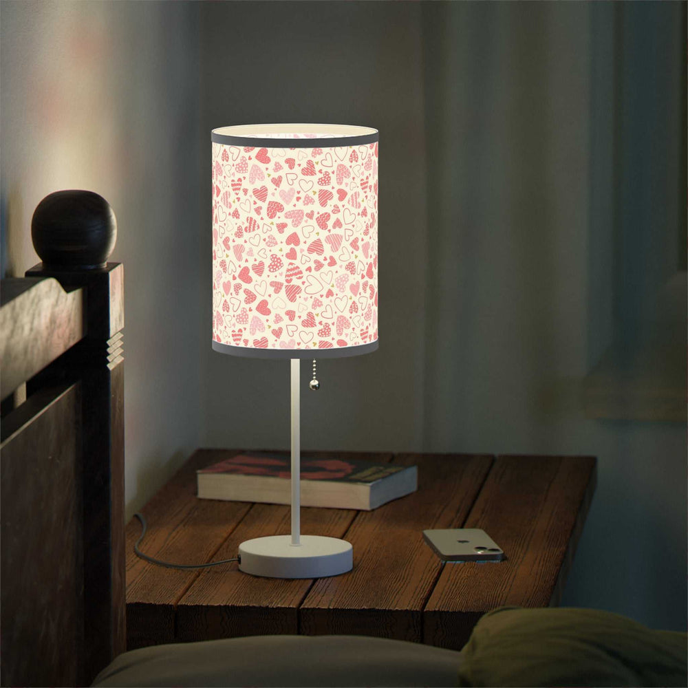 Hearts pattern table lamp with steel base and customizable high-resolution shade trim in silver or white finish