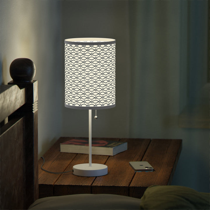 Christian design lamp featuring a steel base with white finish and a high-res printed shade with fish symbol pattern