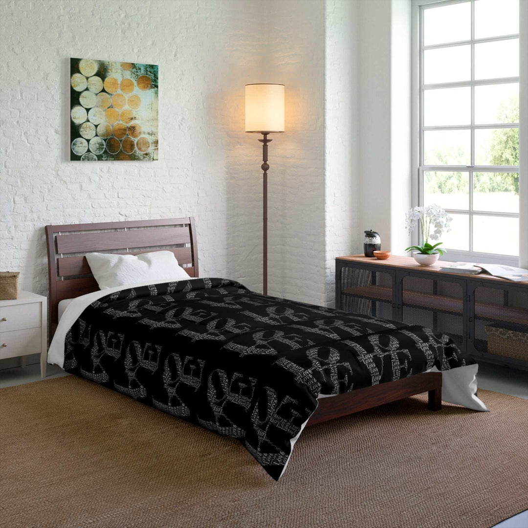 Black Love Words Comforter on bed in bright modern bedroom with wooden furniture and white walls