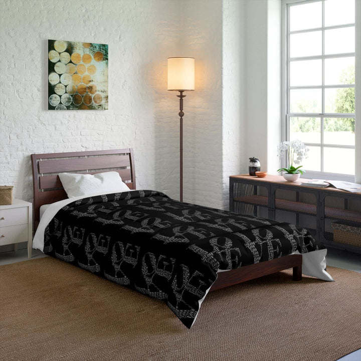 Black Love Words Comforter on bed in bright modern bedroom with wooden furniture and white walls