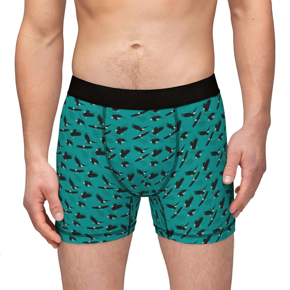 Men's Eagle Flying boxers with black waistband, teal fabric, and all-over eagle print pattern