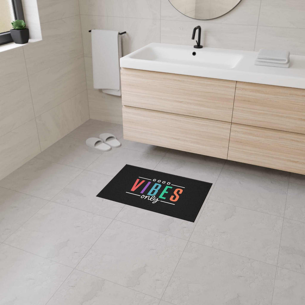 Good Vibes Floor Mat with colorful text on black non-slip polyester backing in bathroom setting