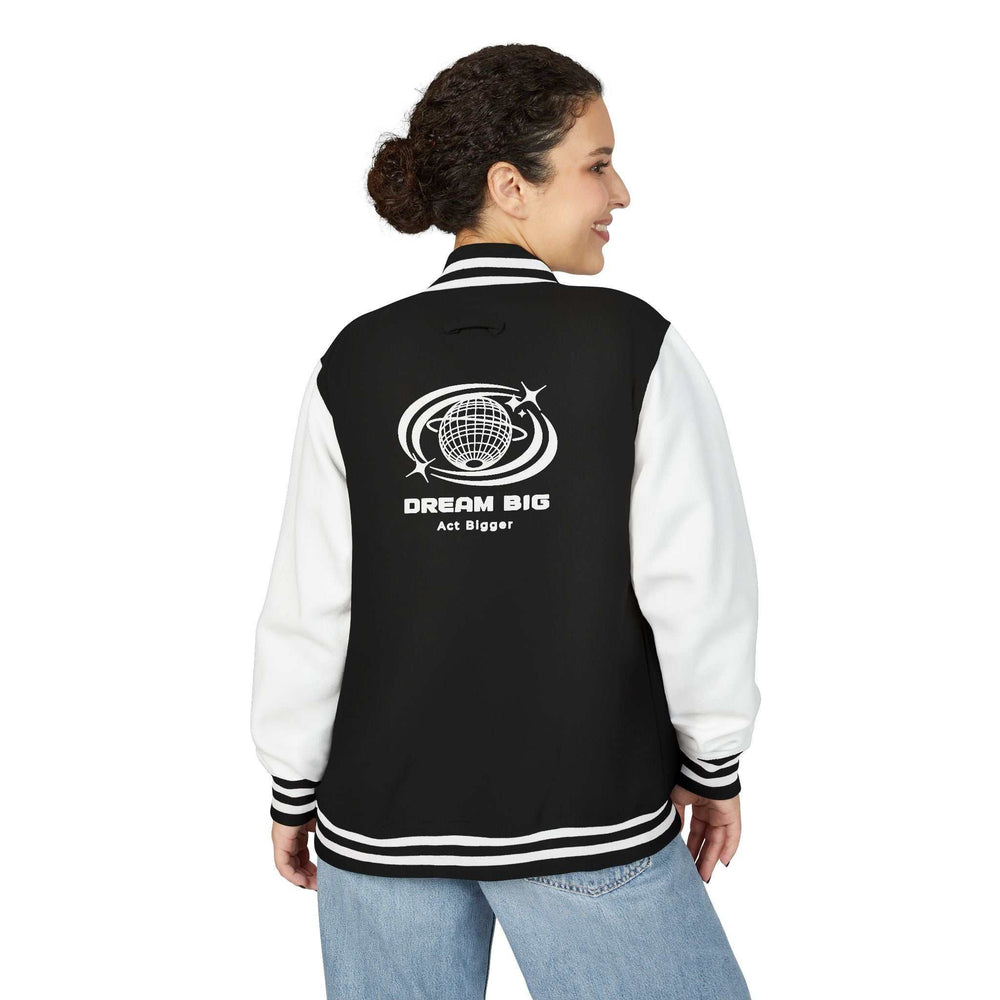 Woman wearing black and white Dream Big jacket with inspirational globe design on back
