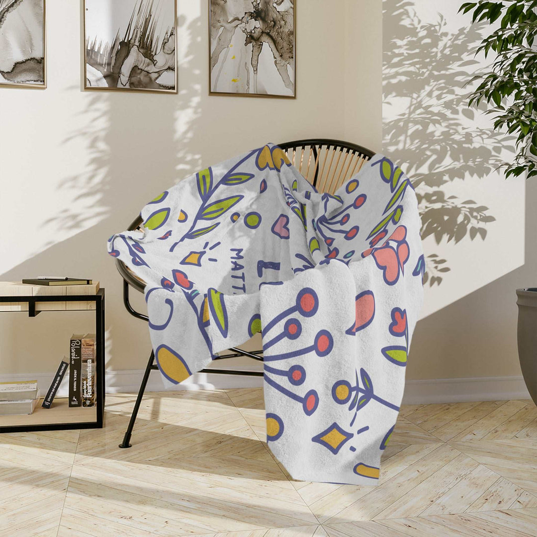 Pray More Blanket soft fleece with colorful abstract floral design on chair in bright room