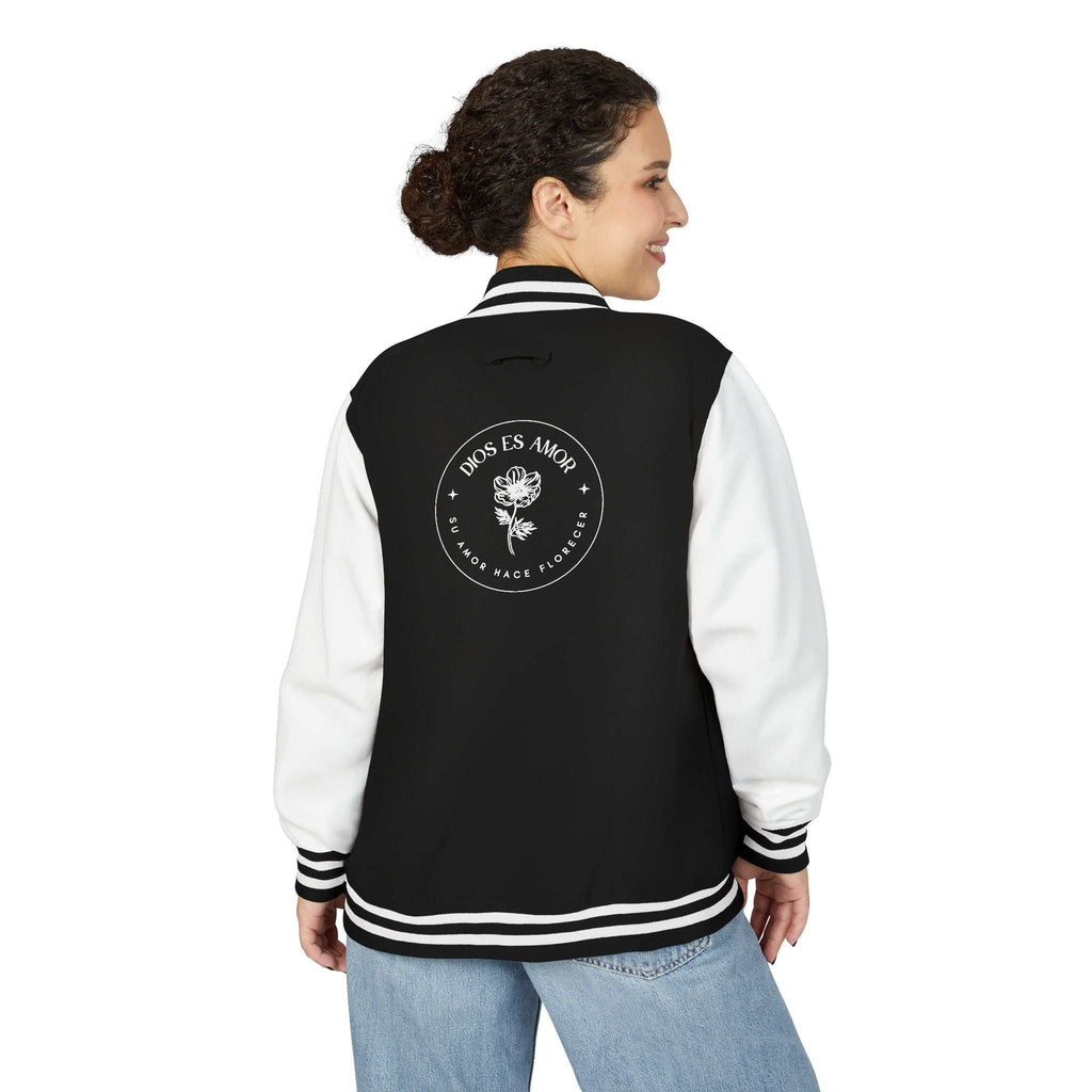 Black and white Dios Es Amor jacket with floral faith design on back, worn by woman