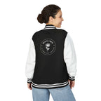 Black and white Dios Es Amor jacket with floral faith design on back, worn by woman