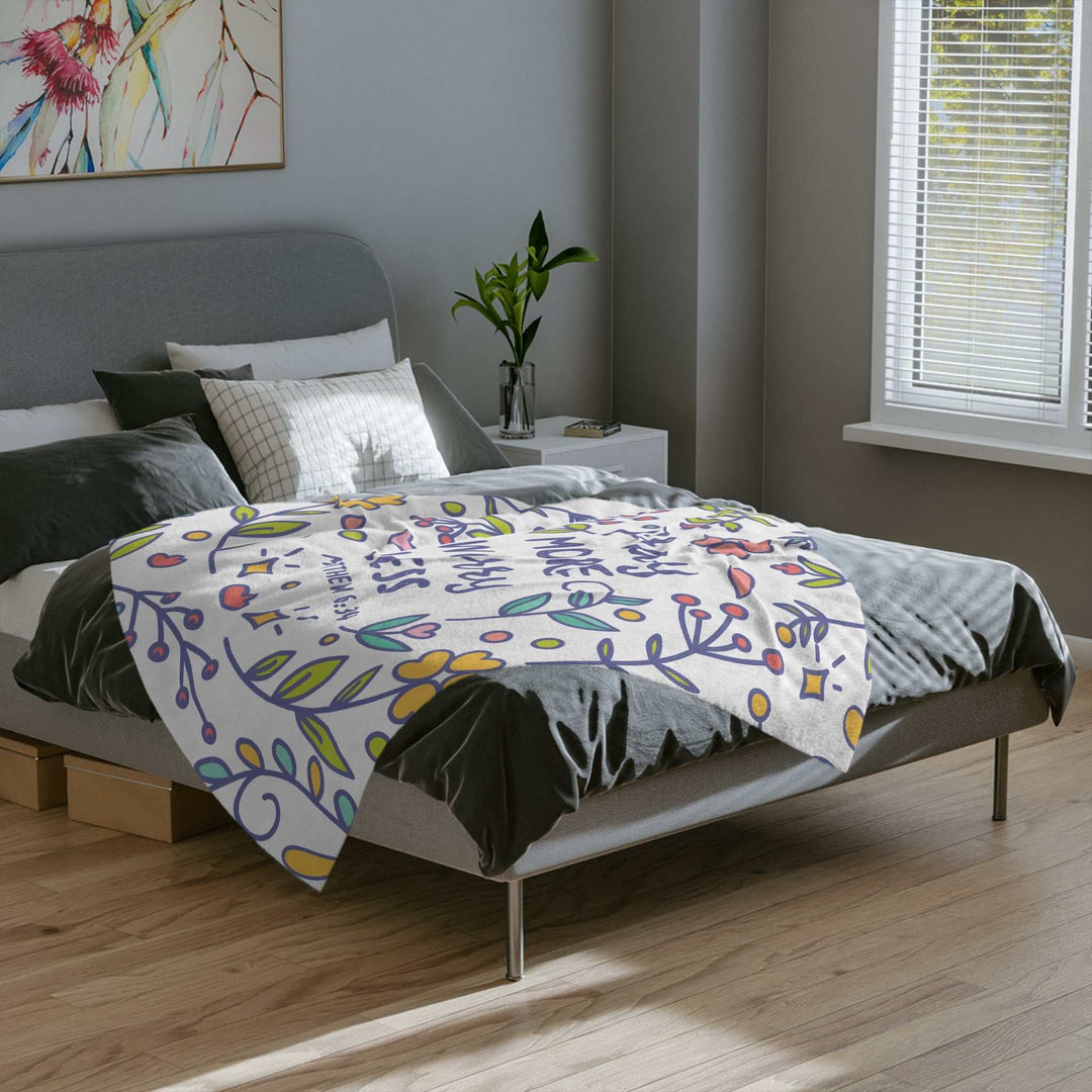 Pray More Blanket soft fleece with colorful floral design on bed in modern bedroom