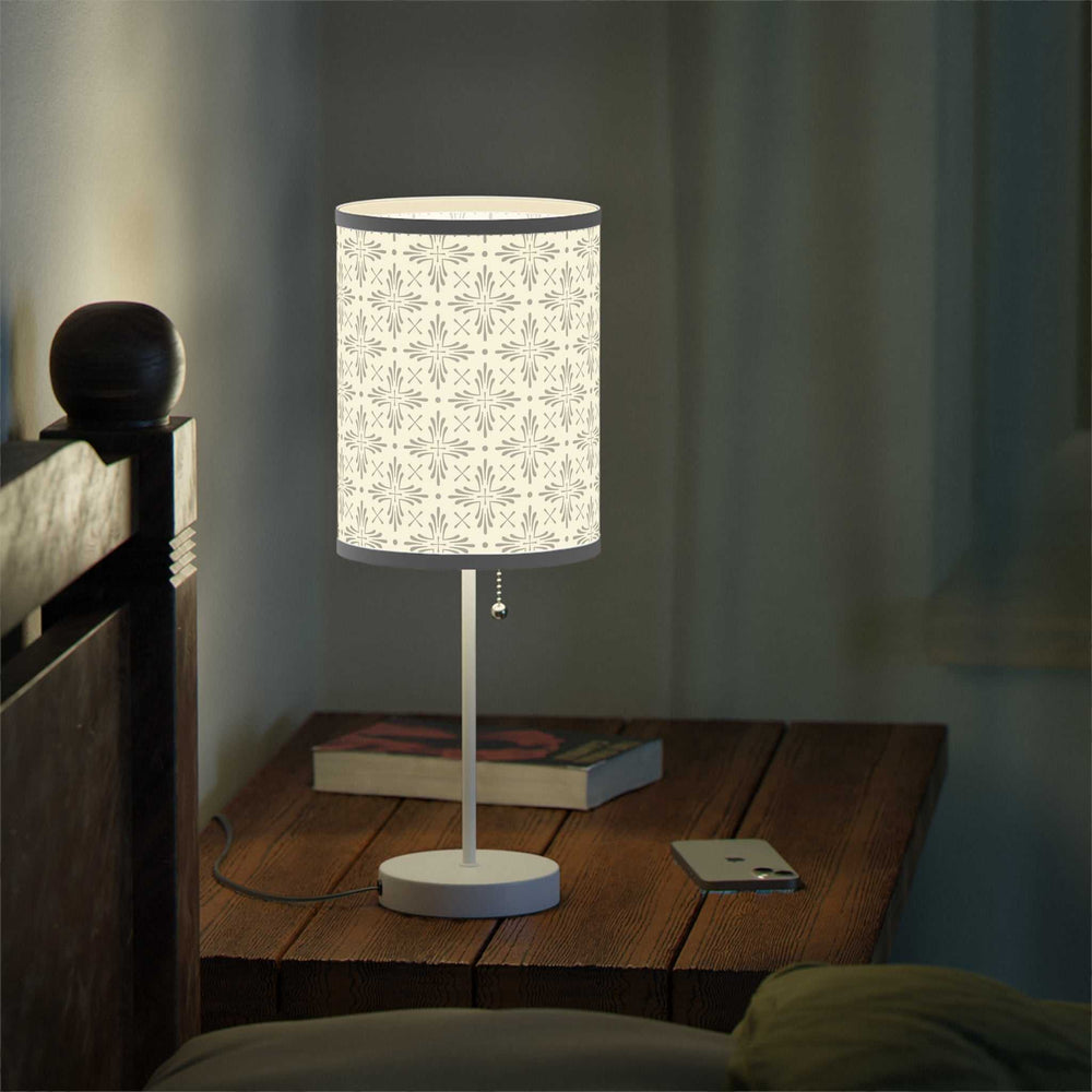 Christian Cross Lamp with steel base and decorative high-res printed shade on wooden bedside table in dim room
