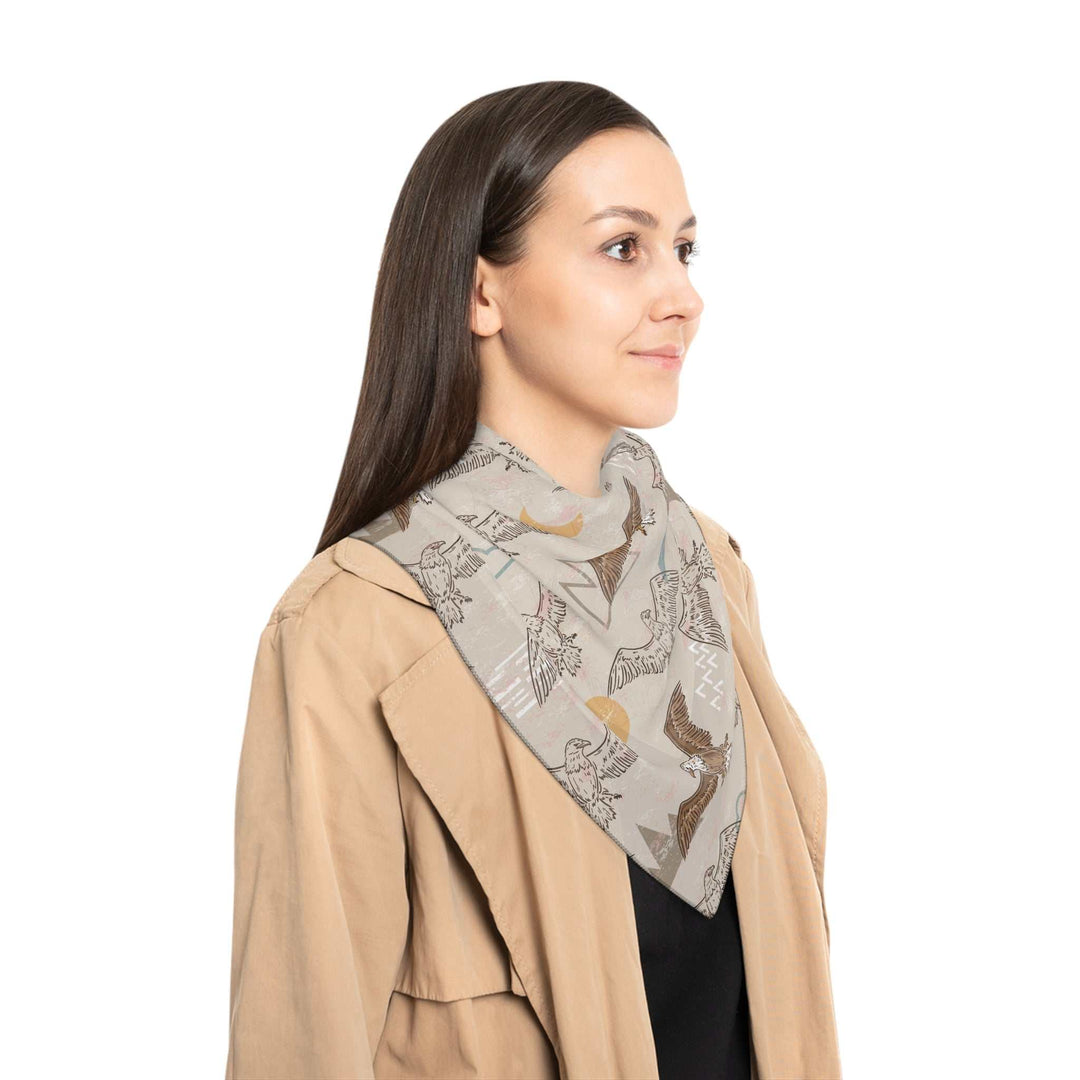Woman wearing Eagle Soaring Poly Scarf made of light, sheer poly voile and chiffon with bird print and black stitching