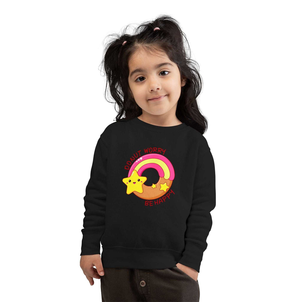 toddler wearing black Donut Worry be happy sweatshirt with star and rainbow design