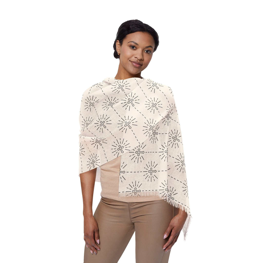 Woman wearing a Christian Light Scarf with transparent fabric and intricate black sunburst pattern on white background