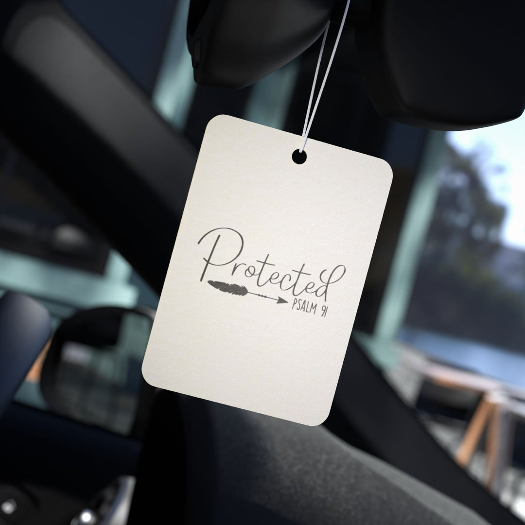 Protected Psalm 91 car air freshener hanging inside vehicle with simple design and string