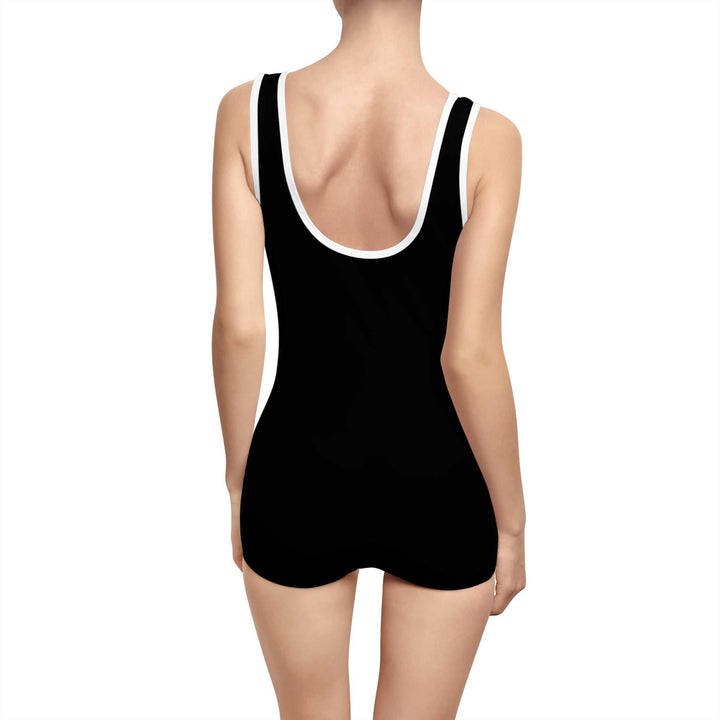 Back view of a woman wearing a black Choose Joy Vintage Swimsuit