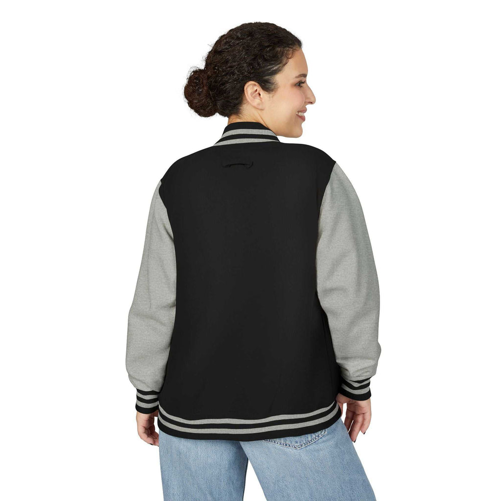 Woman wearing black and gray Christian Cross jacket viewed from the back