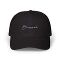 Black Blessed cap with script embroidery, comfortable fit, and antique brass buckle closure