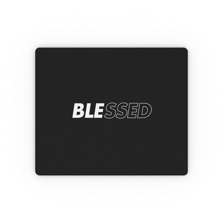 Black mouse pad with the word "BLESSED" in bold white and outlined letters, featuring a durable cloth surface and non-slip rubber backing.