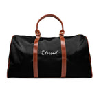 Black Blessed travel bag with brown PU leather handles and gold zipper, made of durable nylon material.
