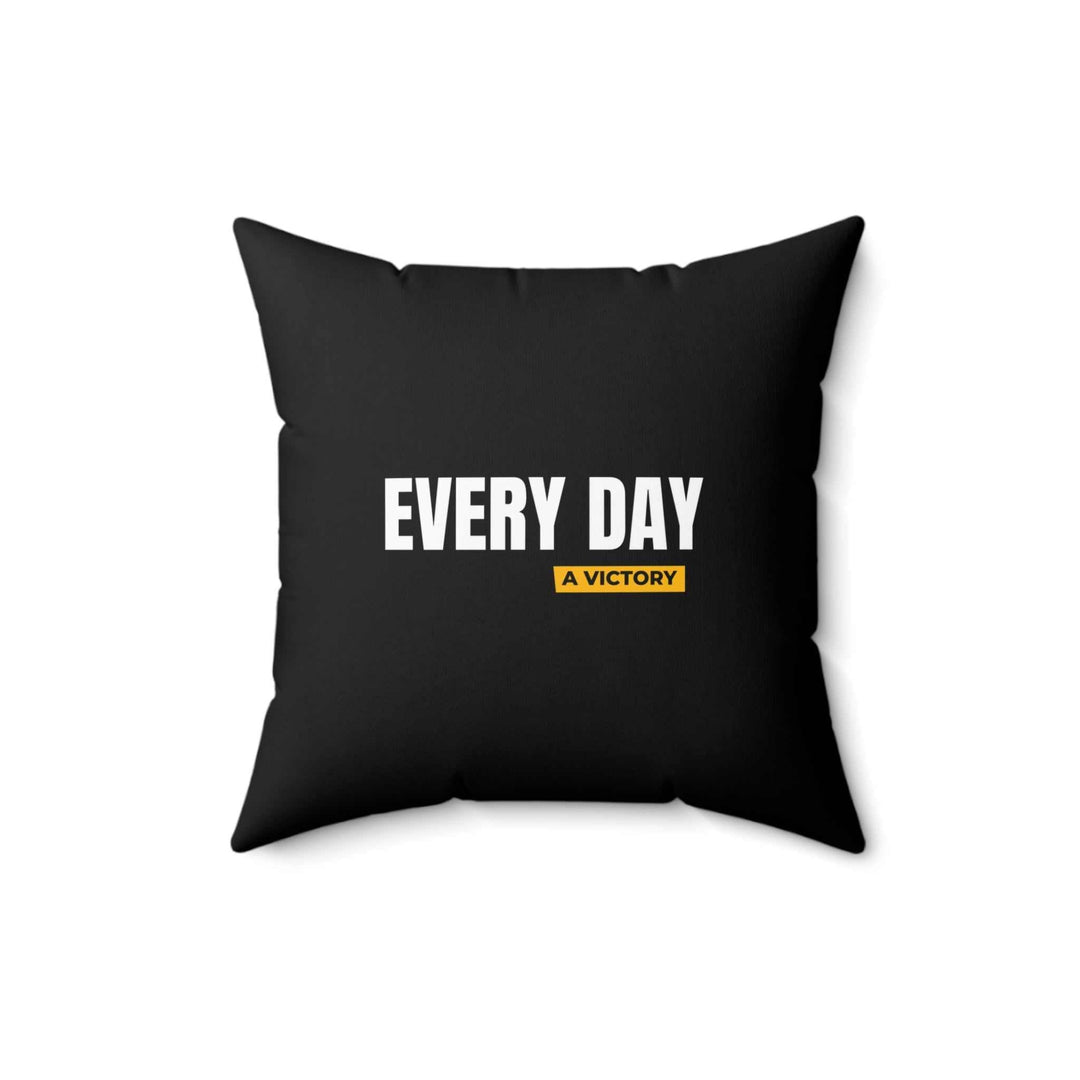 Black motivational pillow with white and yellow text "EVERY DAY A VICTORY" and concealed zipper