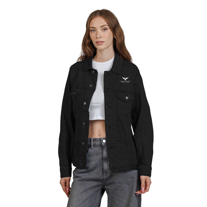 Woman wearing black Eagle Mindset denim jacket with chest pockets and button closure