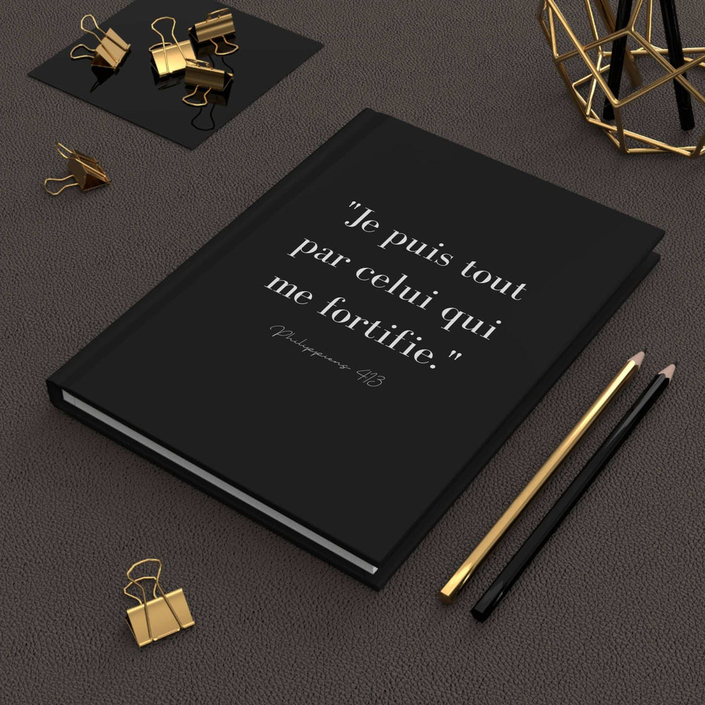 Black matte journal with French Bible verse on cover, featuring 150 lined pages and casewrap binding for faith reflections and spiritual growth.