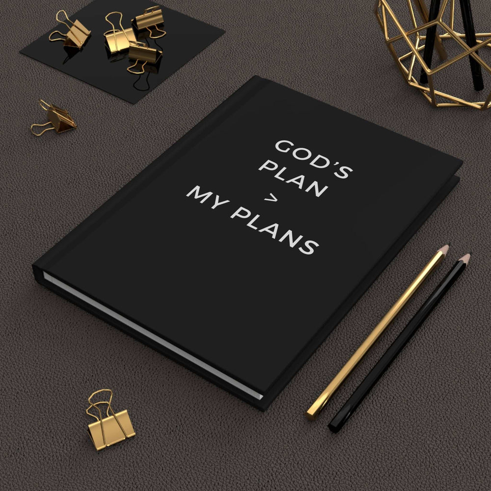 Black hardcover journal with "God's Plan > My Plans" text, matte finish and lined pages for spiritual growth and faith tracking