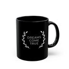 Black ceramic mug with "Dreams Come True" text and laurel design, 11oz, glossy finish, microwave and dishwasher safe