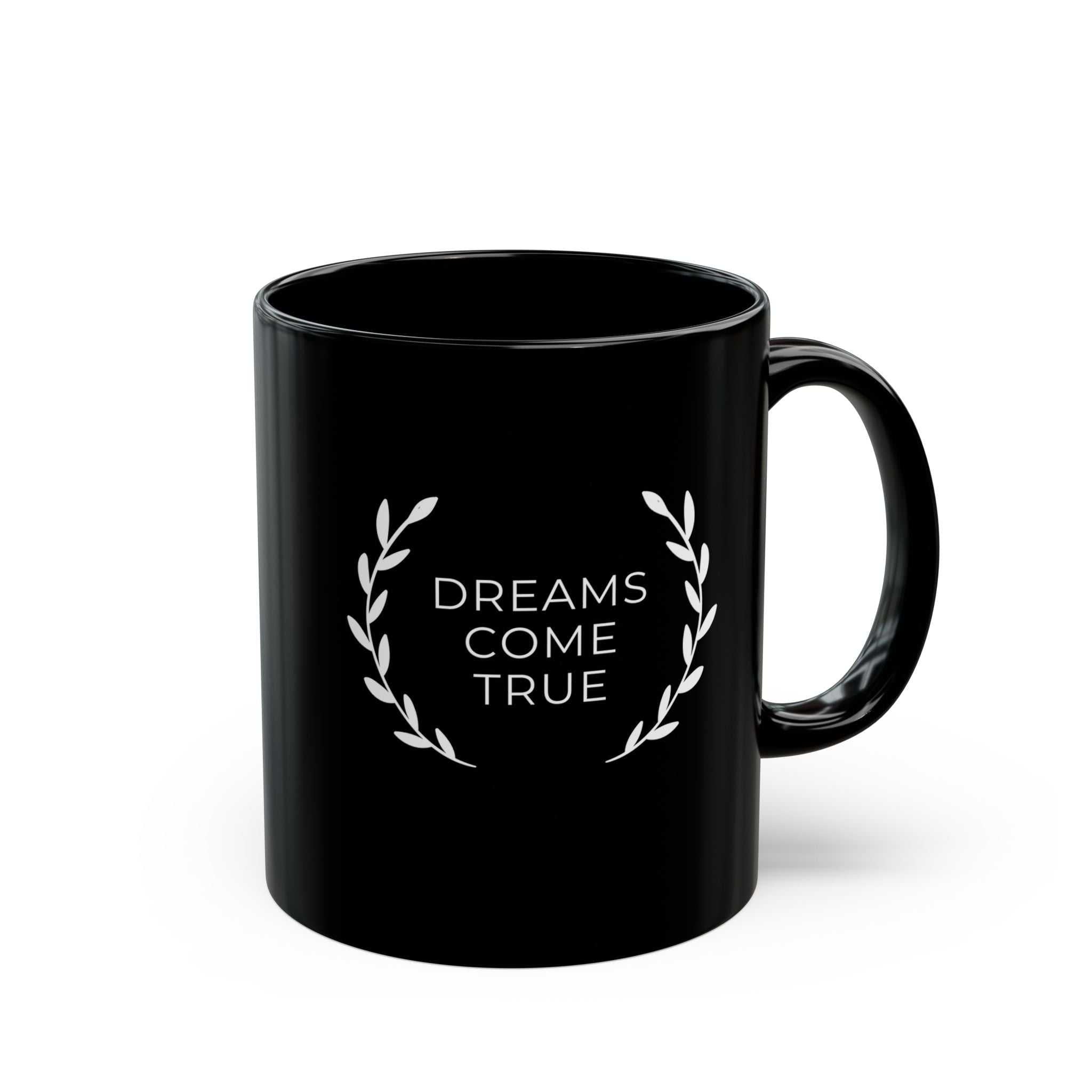 Black ceramic mug with "Dreams Come True" text and laurel design, 11oz, glossy finish, microwave and dishwasher safe