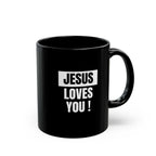 Black ceramic mug with white "Jesus Loves You!" text, 11oz, microwave and dishwasher safe.