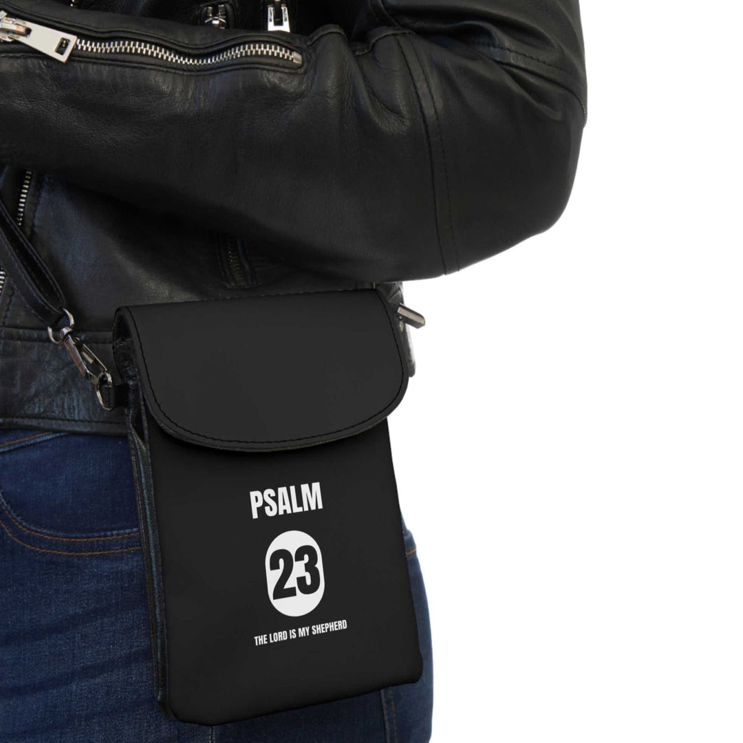 Black Psalm 23 cell phone wallet with adjustable strap worn crossbody, faux leather, compact and durable design