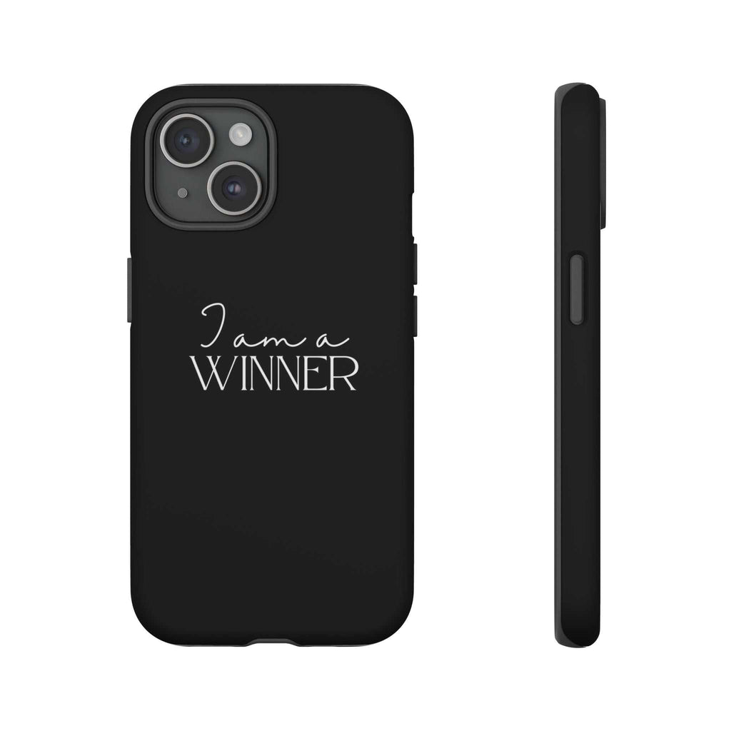 Black matte phone case with "I am a WINNER" text, dual-layer durable protection, and clear port access.