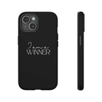 Black matte phone case with "I am a WINNER" text, dual-layer durable protection, and clear port access.