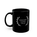 Black ceramic mug with "Dreams Come True" text and laurel design, 11oz, glossy finish, microwave and dishwasher safe