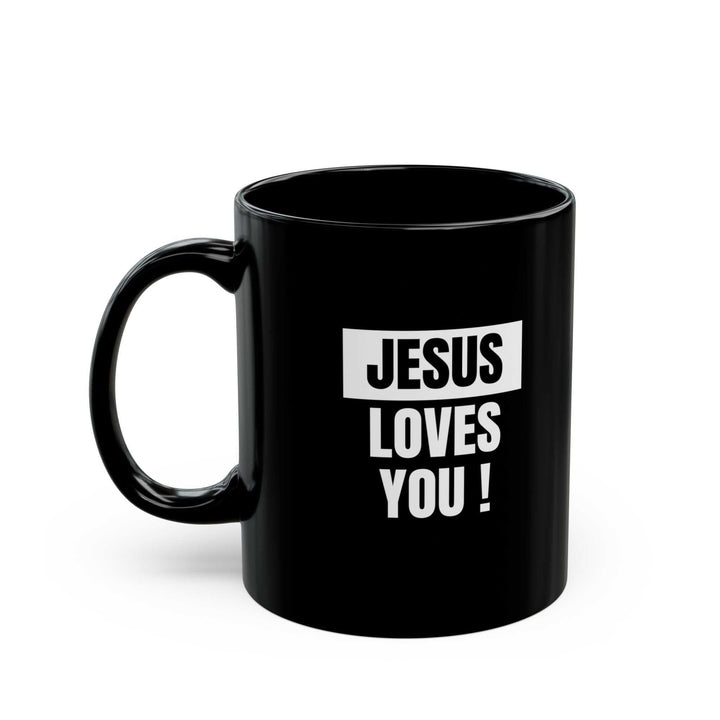 Black ceramic mug with "Jesus Loves You!" text, 11oz, microwave and dishwasher safe.