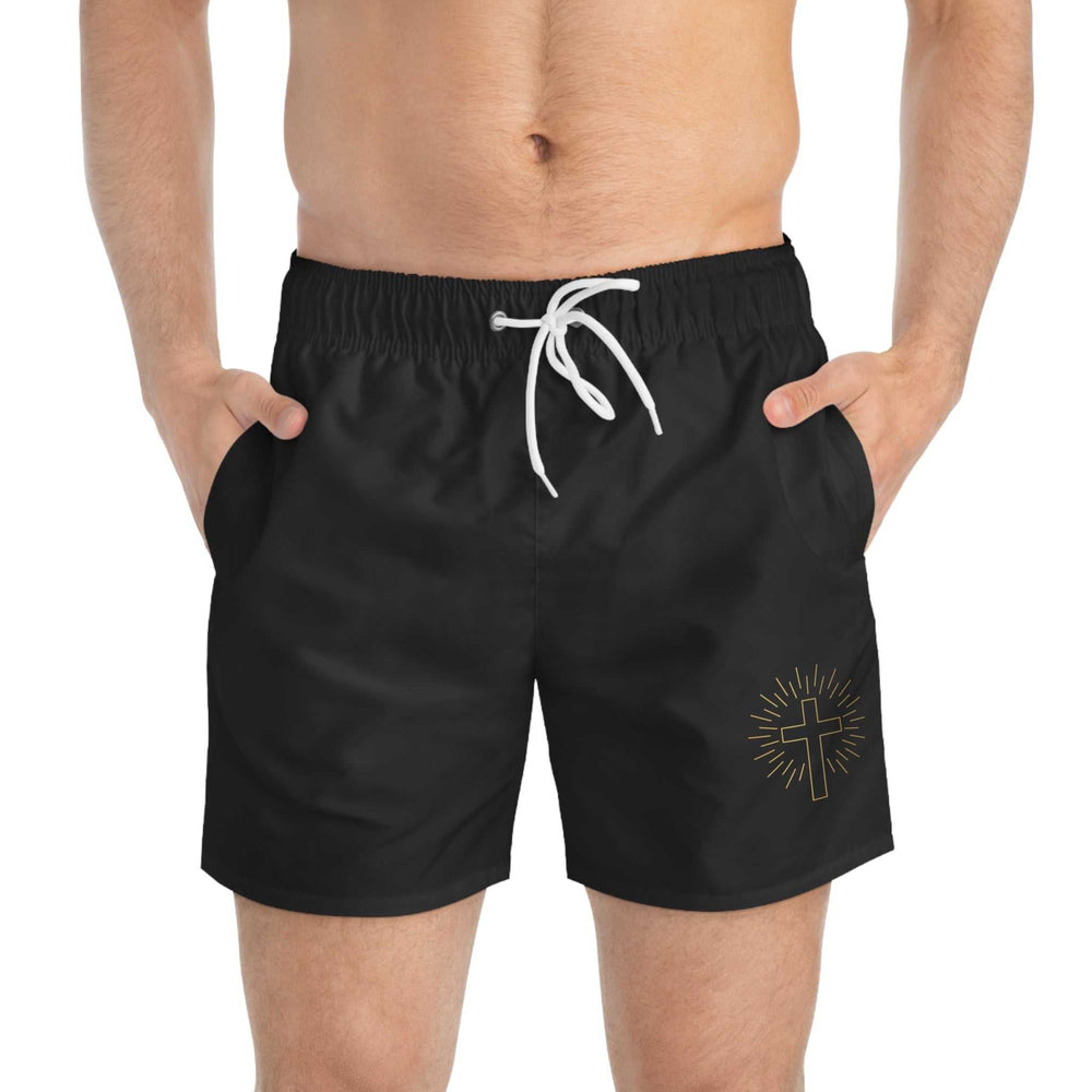 Black swim trunks with white drawstring and golden cross design